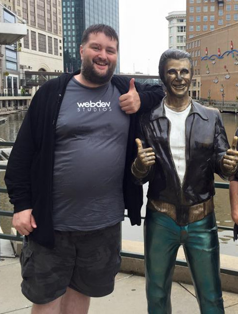 Picture of Michael next to the Bronze Fonze in Milwaukee WI.